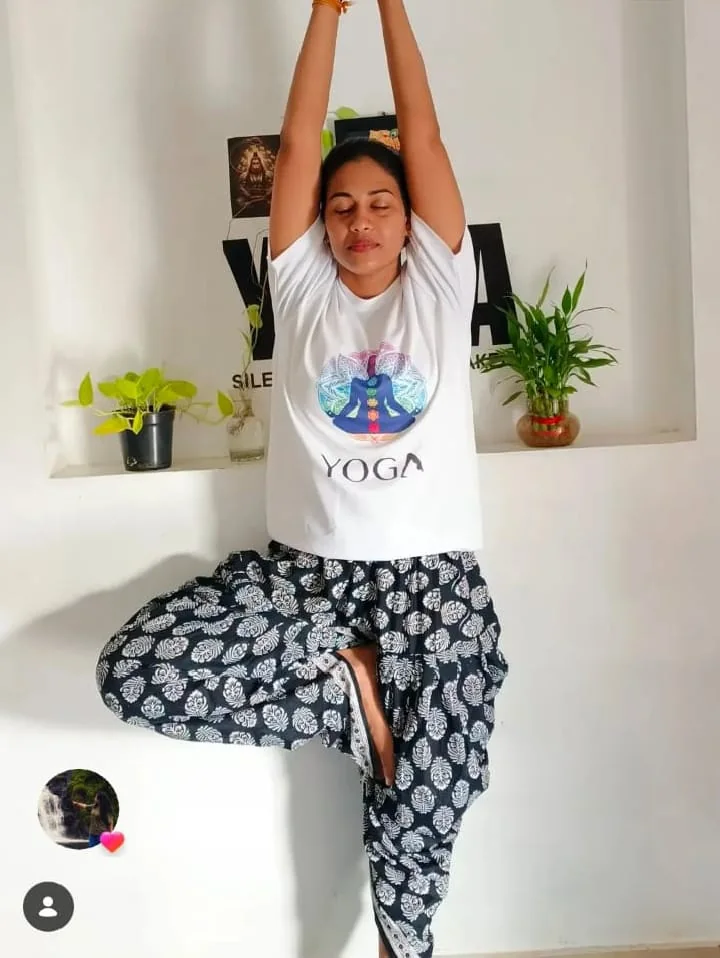 Instructor demonstrating a yoga posture