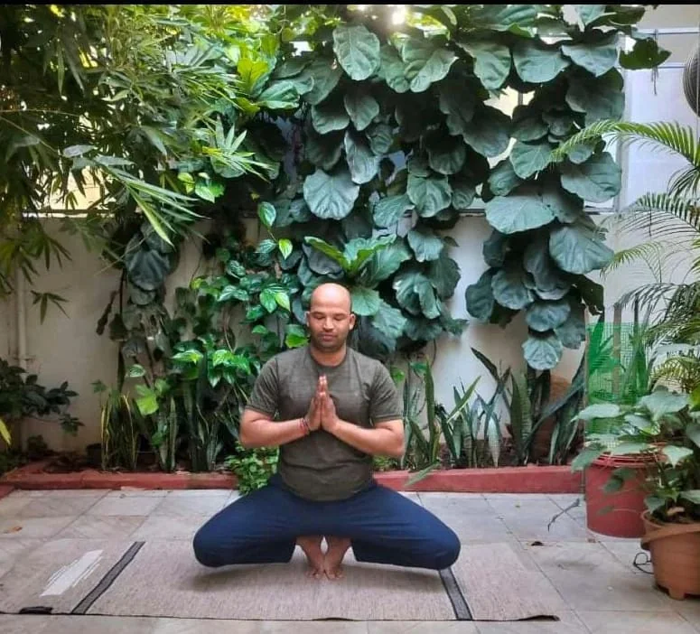 Ashok Rao practicing yoga outdoors
